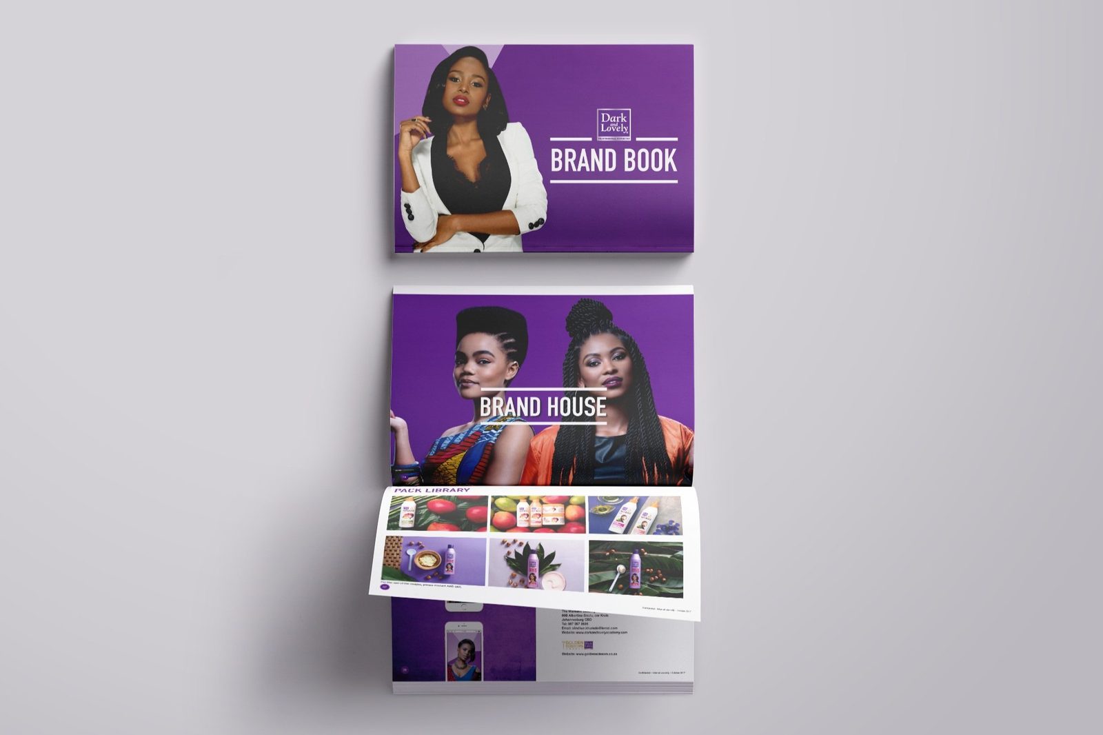 Dark and Lovely Brand Book, purple covers with Brand Book and Brand House spreads